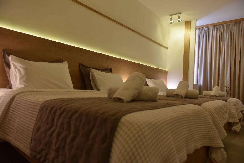 Postel nebo postele na pokoji v ubytování Hotel Xanthippion
