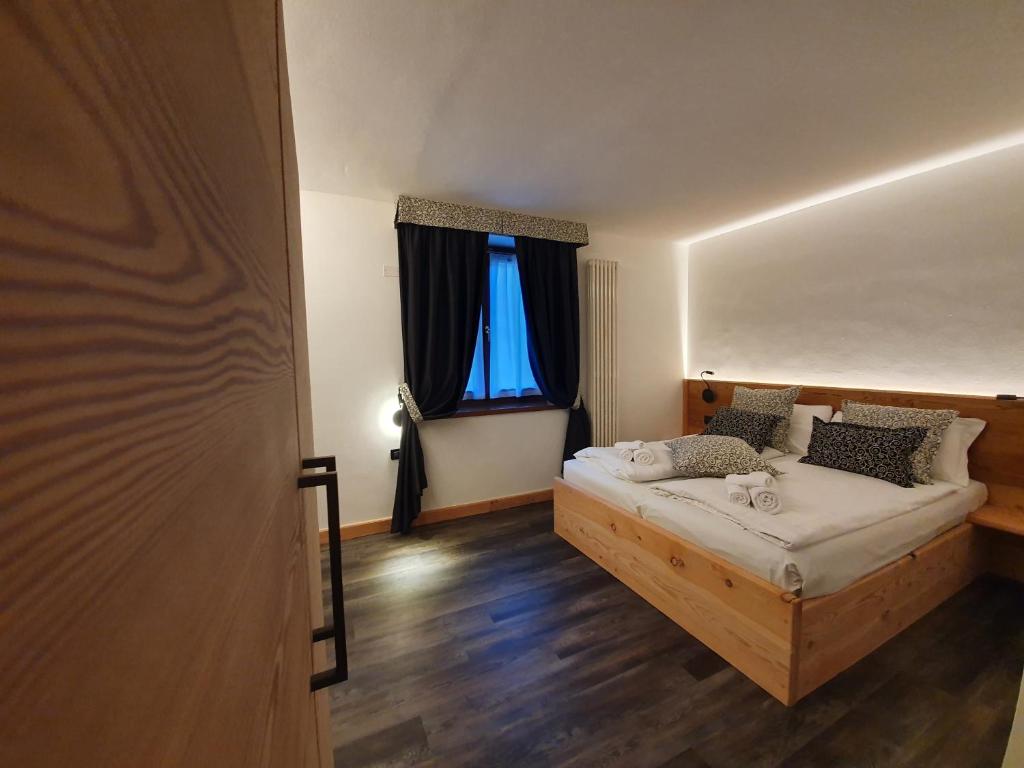 Postel nebo postele na pokoji v ubytování Hotel Pezzotti