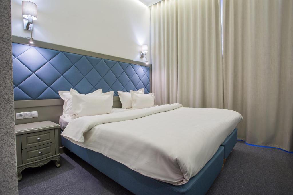 Postel nebo postele na pokoji v ubytování Spa-Hotel Myslyvskiy Dvir