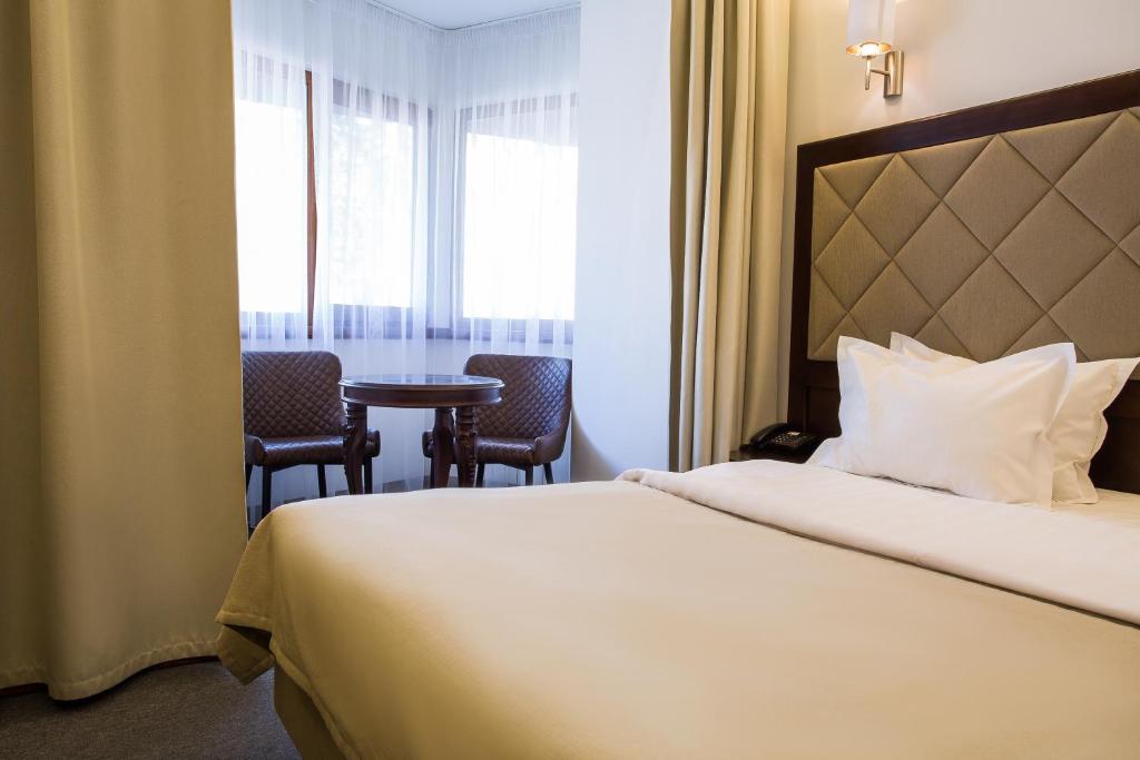Postel nebo postele na pokoji v ubytování Spa-Hotel Myslyvskiy Dvir