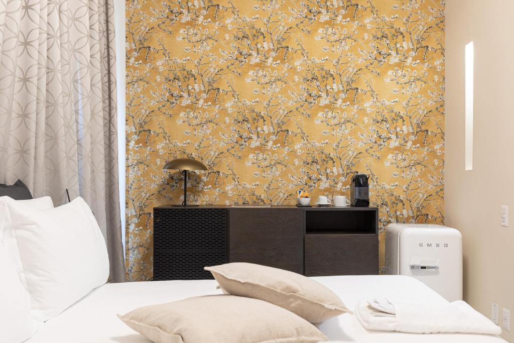A bed or beds in a room at BePlace Apartments in Duomo