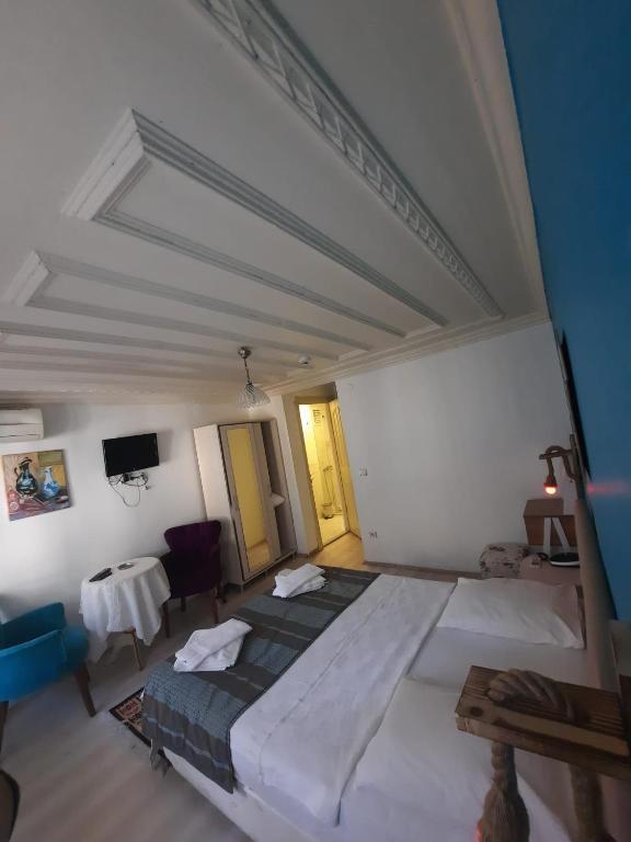 Postel nebo postele na pokoji v ubytování Masal Hotel