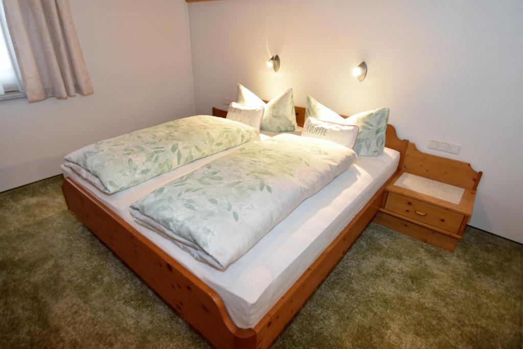 Postel nebo postele na pokoji v ubytování Haus Waldner