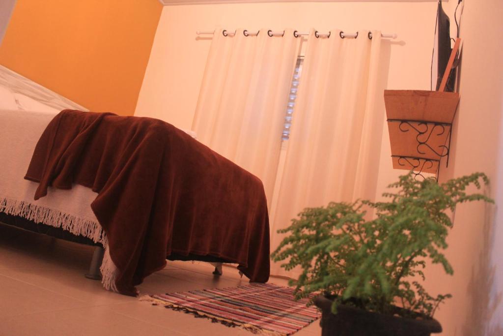 Postel nebo postele na pokoji v ubytování Suítes Tia Olívia