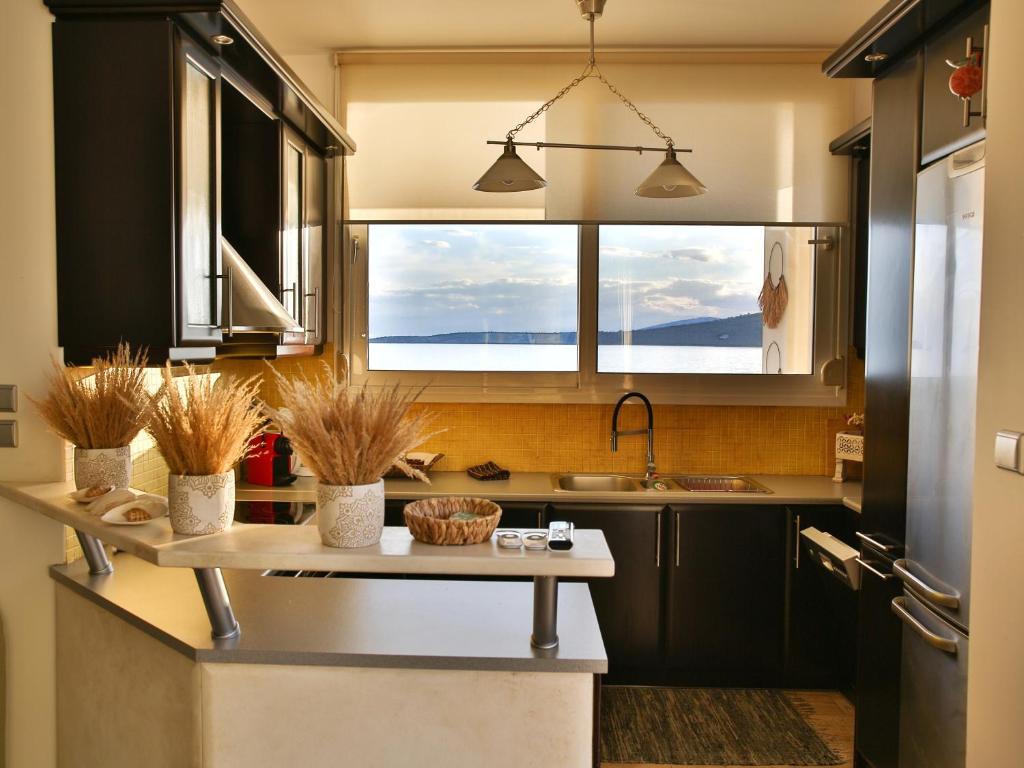 Boho Beach House in Itea-Delphi 주방 또는 간이 주방