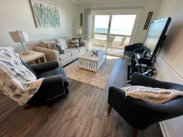 a living room with a couch and chairs and a television at Sea Shadow 205 Condo in Myrtle Beach