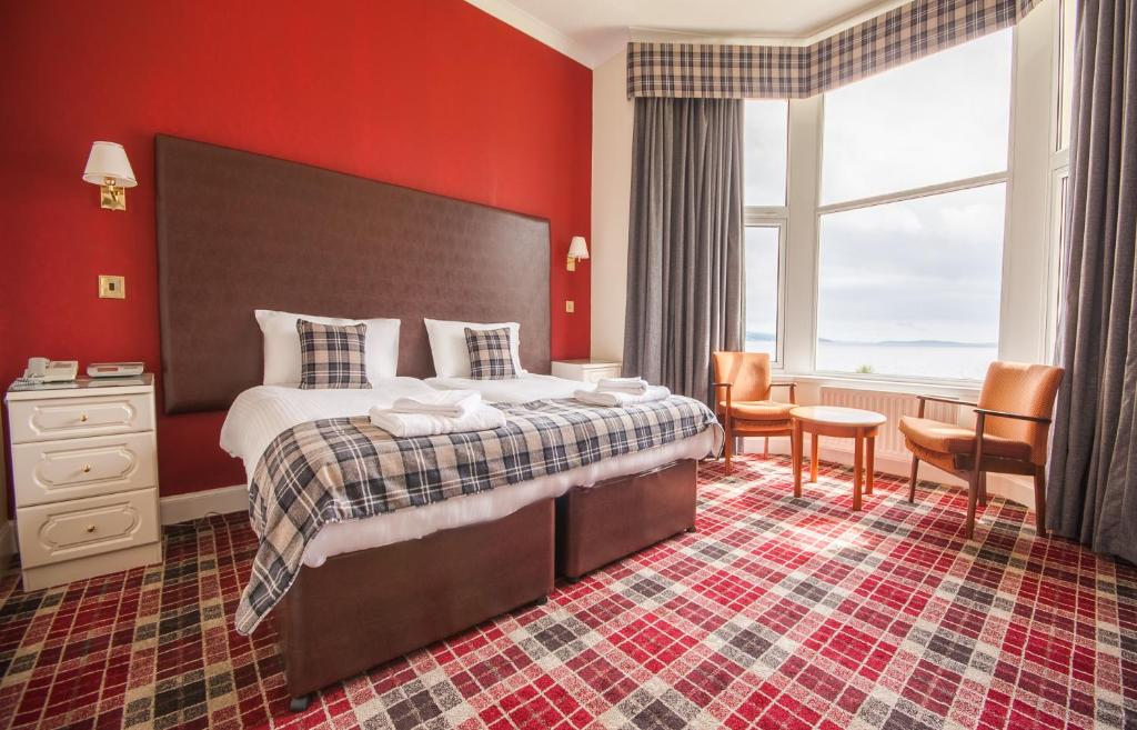 Postel nebo postele na pokoji v ubytování SGE Esplanade Hotel