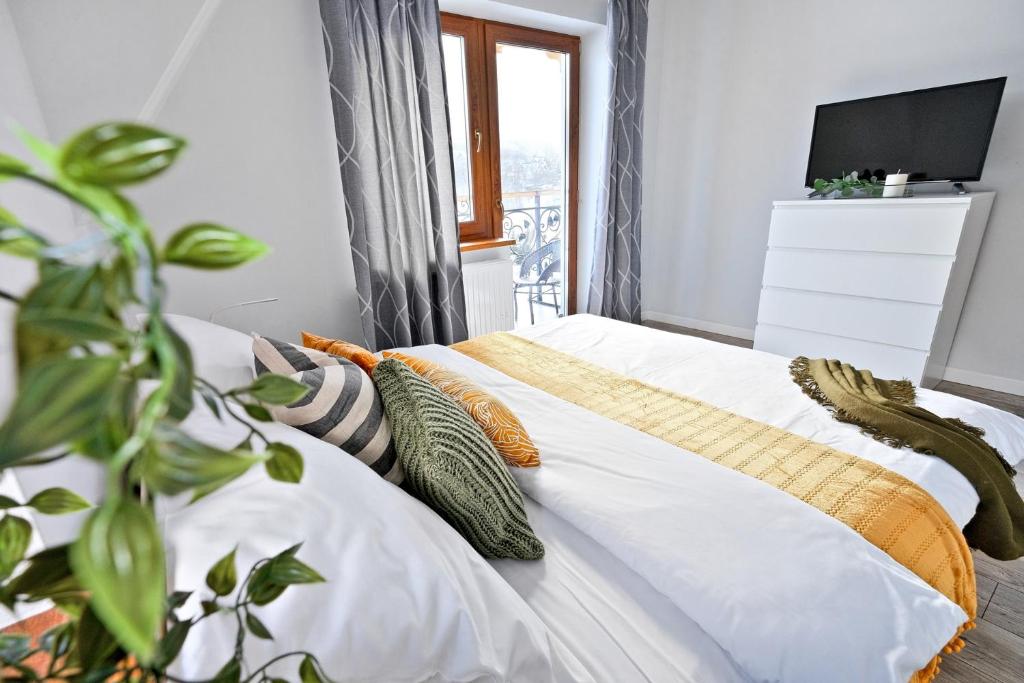 Posteľ alebo postele v izbe v ubytovaní Apartamenty Maciejka Odkryj Zakopane