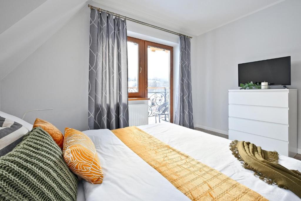 Posteľ alebo postele v izbe v ubytovaní Apartamenty Maciejka Odkryj Zakopane