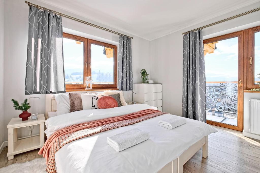 Posteľ alebo postele v izbe v ubytovaní Apartamenty Maciejka Odkryj Zakopane