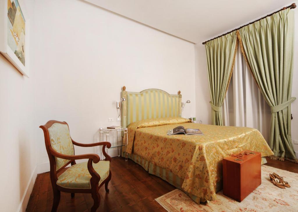 Postel nebo postele na pokoji v ubytování Tenuta Ponziani Wine Resort&Spa