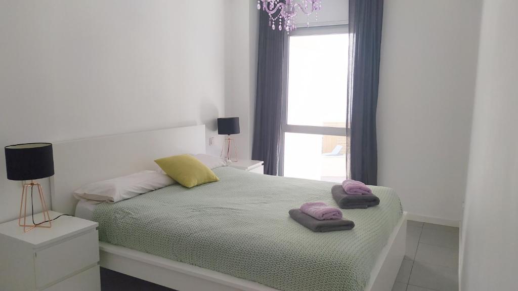 A bed or beds in a room at Casa Rincón Medanero