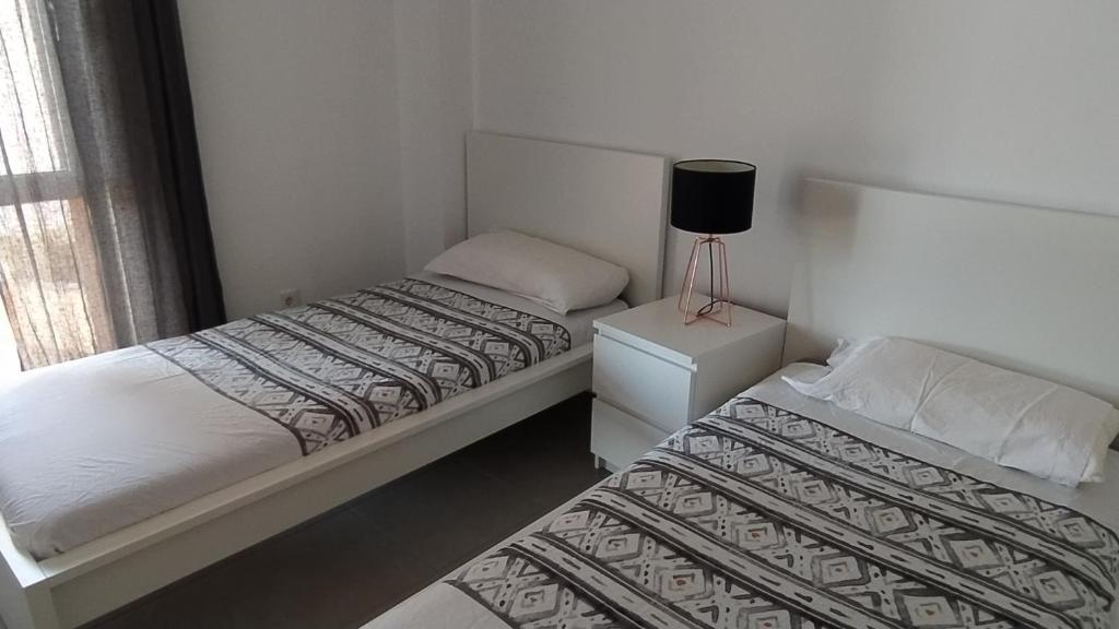A bed or beds in a room at Casa Rincón Medanero