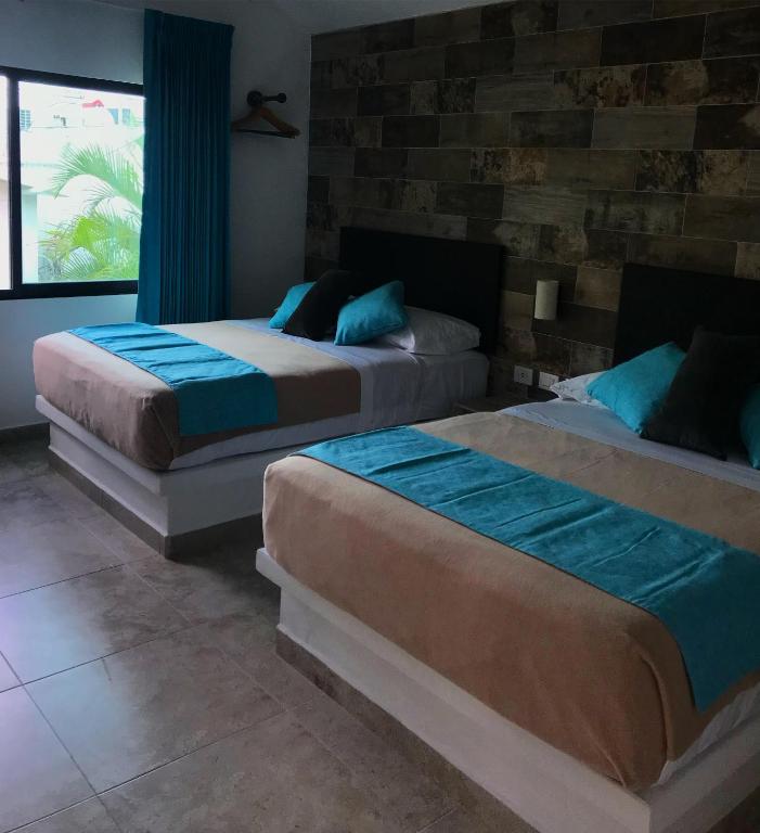 Postel nebo postele na pokoji v ubytování Hotel Aldea 19 Bacalar