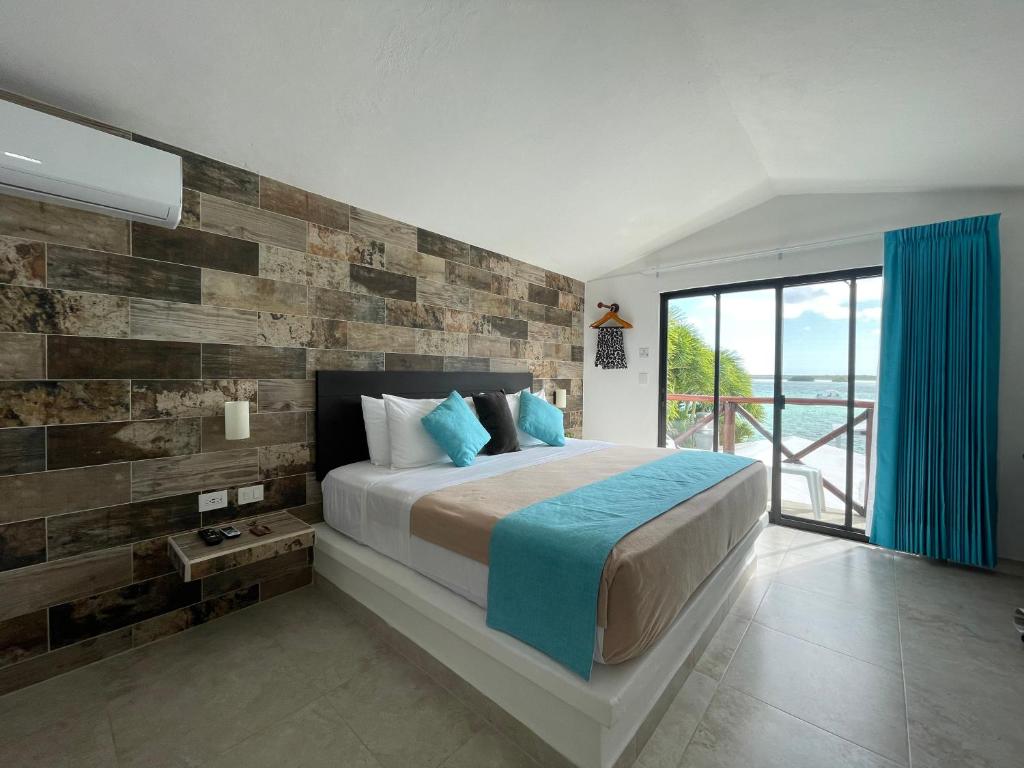 Postel nebo postele na pokoji v ubytování Hotel Aldea 19 Bacalar