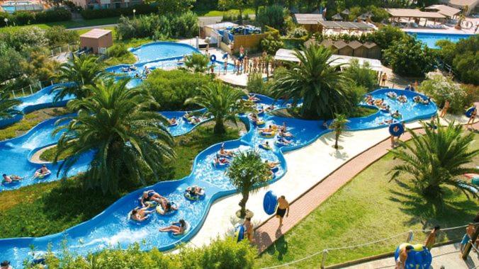 an aerial view of a water park with people in it at CAP D&#39;AGDE studio cabine 6 pers. + terrasse + parking privé + clim (calme) in Cap d&#39;Agde