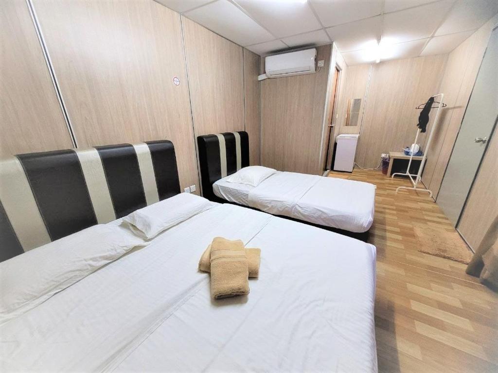 Postel nebo postele na pokoji v ubytování Hasina Resort @Sedili