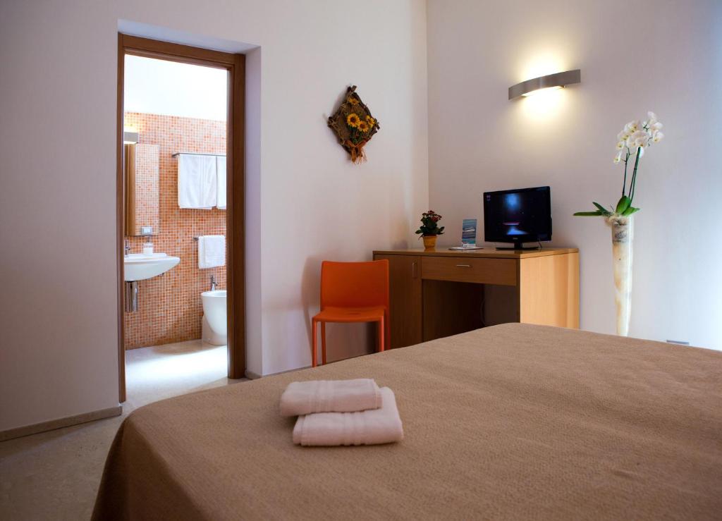 Postel nebo postele na pokoji v ubytování Le Saline Hotel