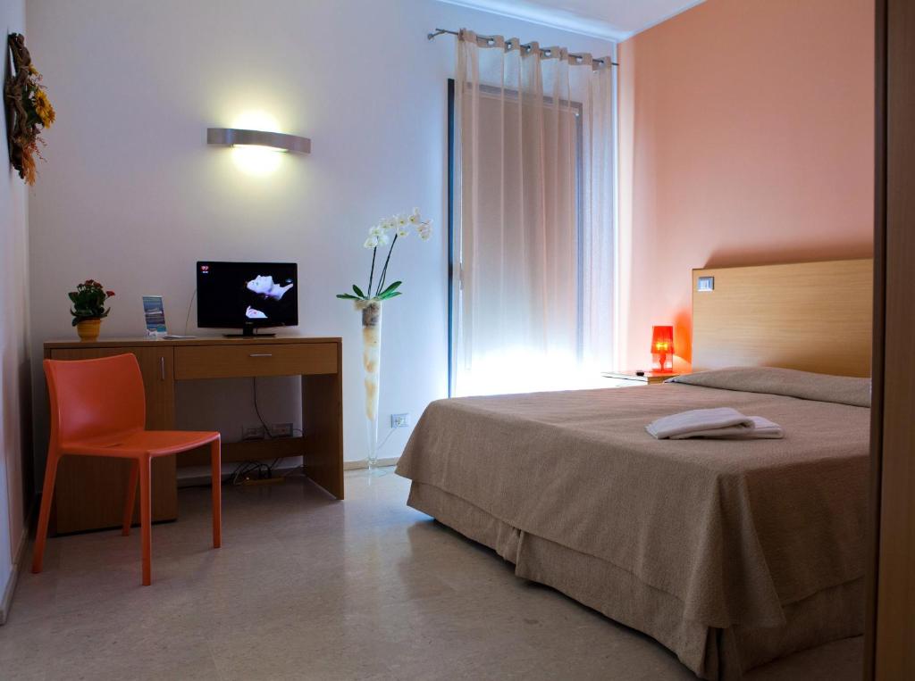 TV a/nebo společenská místnost v ubytování Le Saline Hotel