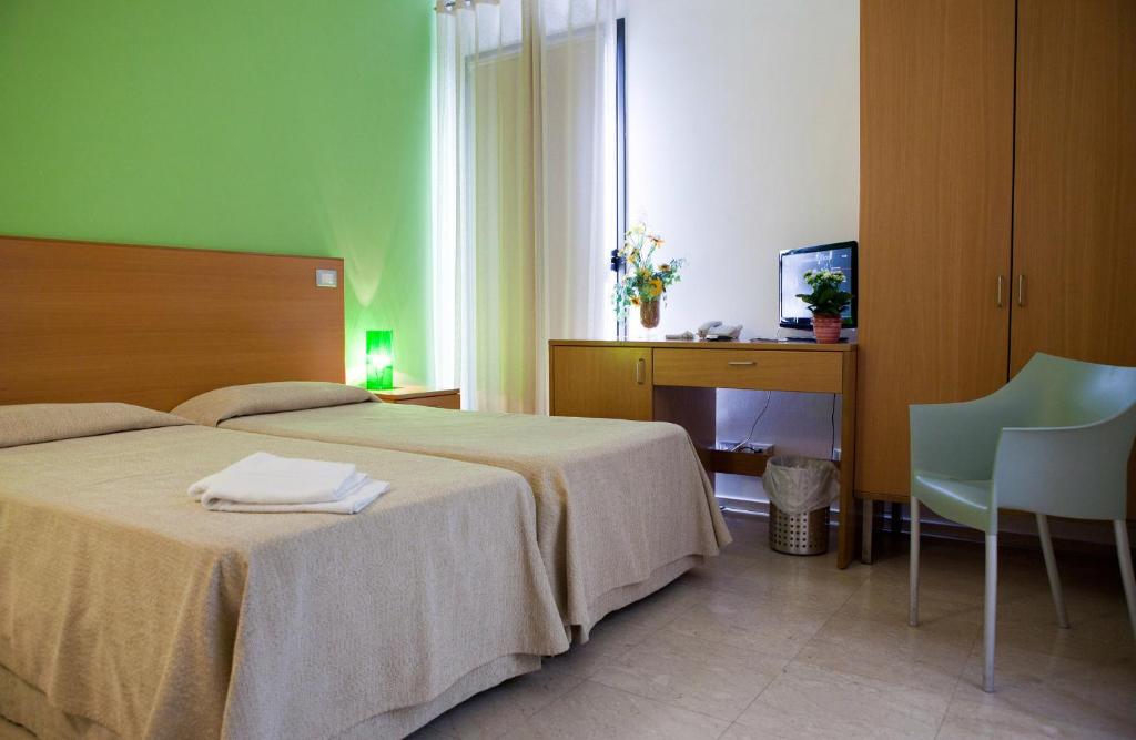 Postel nebo postele na pokoji v ubytování Le Saline Hotel
