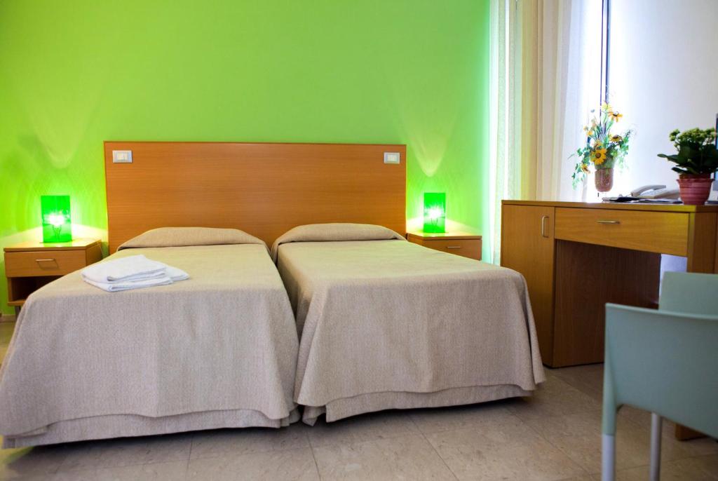 Postel nebo postele na pokoji v ubytování Le Saline Hotel