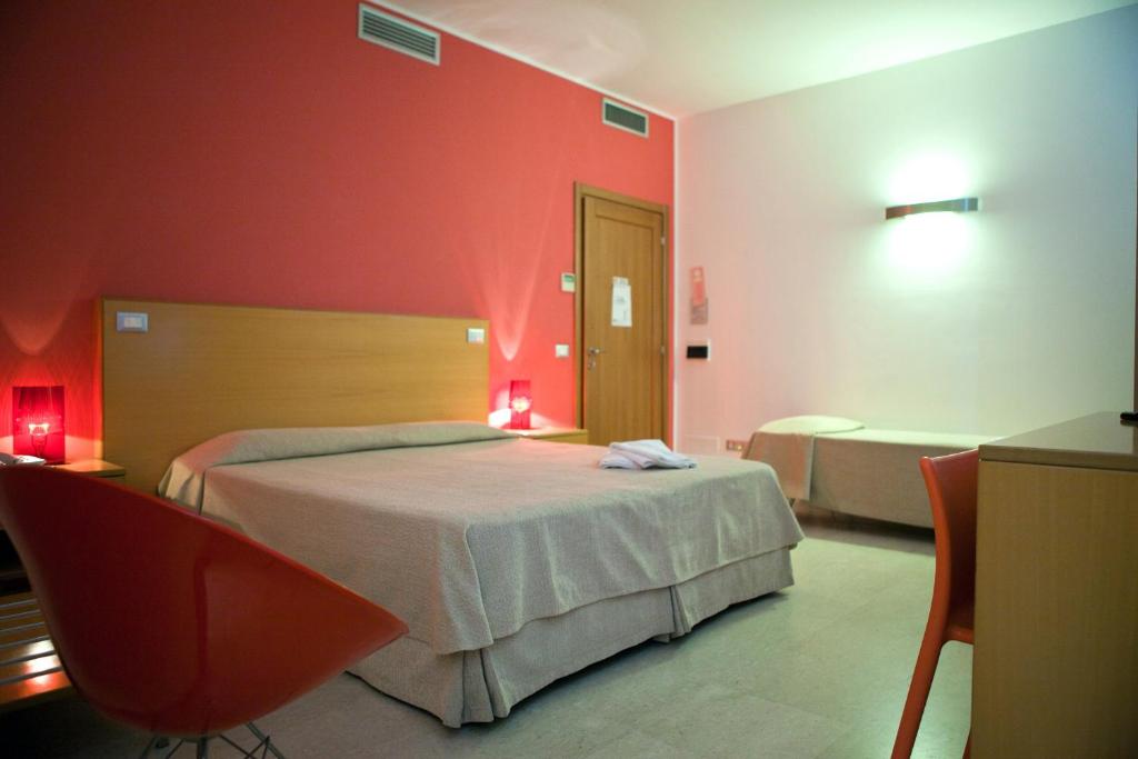 Postel nebo postele na pokoji v ubytování Le Saline Hotel