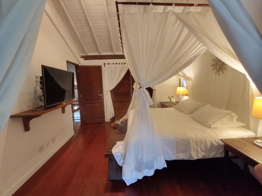 Postel nebo postele na pokoji v ubytování Monkey Casa Hotel