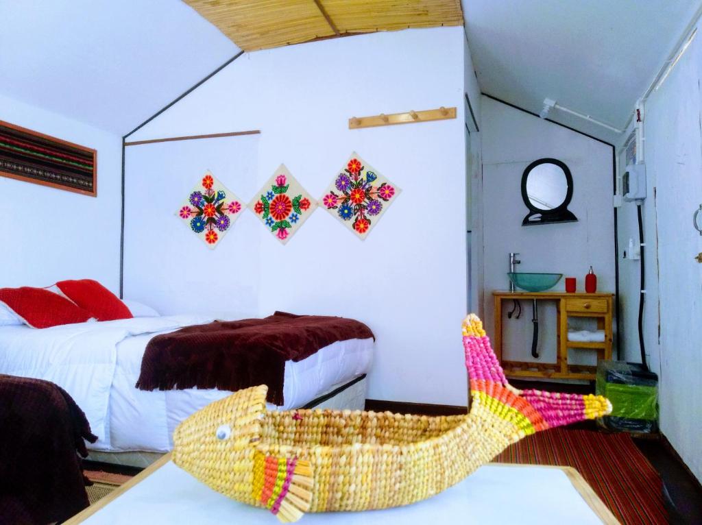 Postel nebo postele na pokoji v ubytování Titicaca wasy lodge