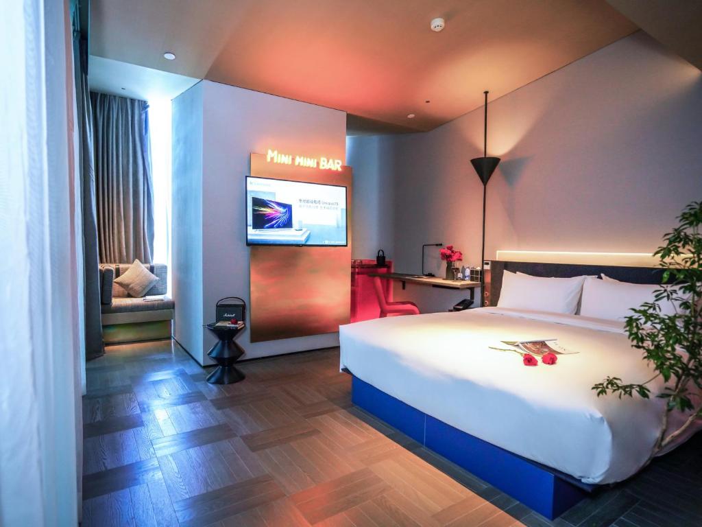 Postel nebo postele na pokoji v ubytování Grade Hotel Shenzhen Shekou Sea World