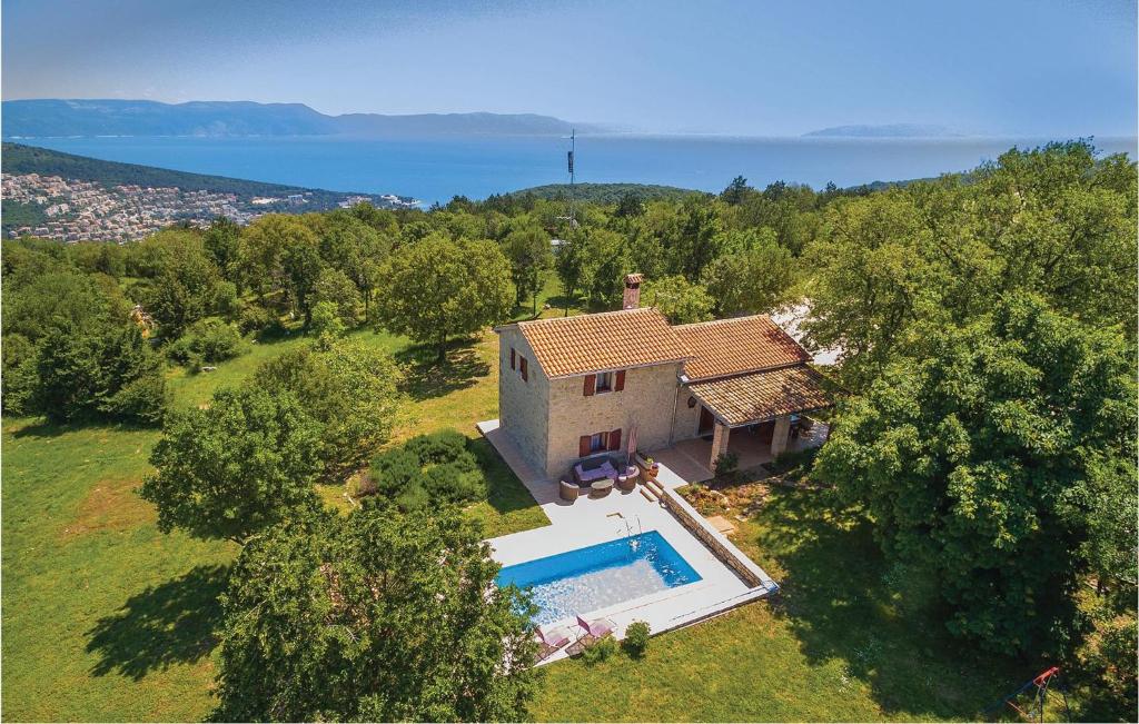 an aerial view of a house with a swimming pool at Stunning Home In Gondolici With House A Panoramic View in Labin