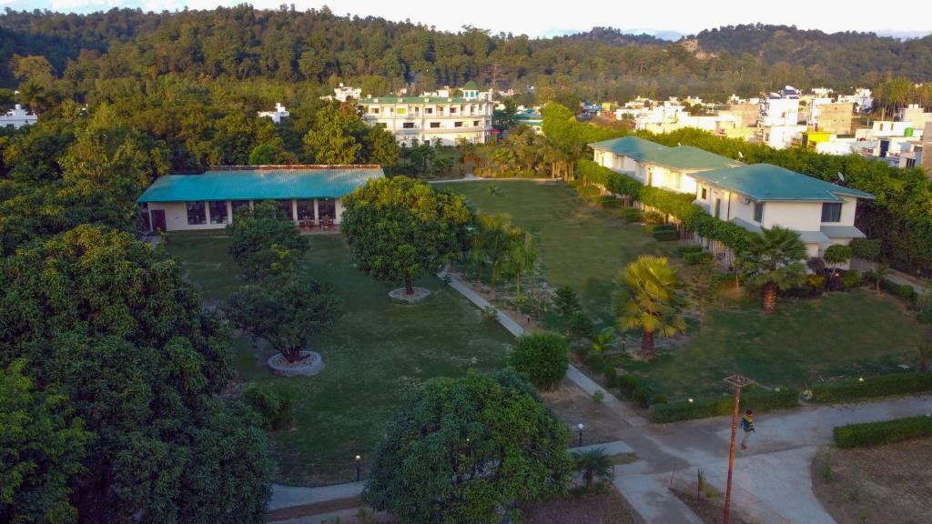 an aerial view of a park with trees and buildings at The Tattwaa Corbett Spa & Retreat in Rāmnagar