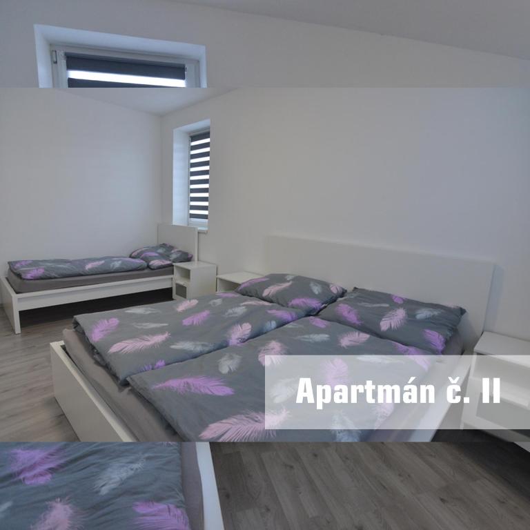 Postel nebo postele na pokoji v ubytování Apartmány U koupaliště
