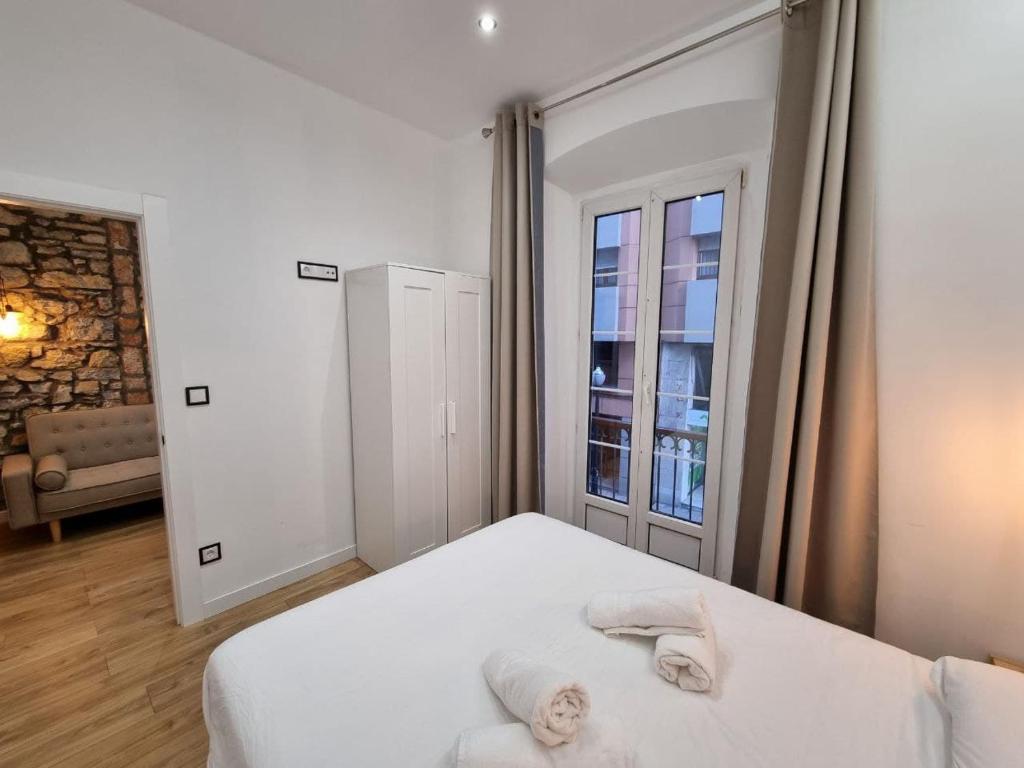 Postel nebo postele na pokoji v ubytování 119A - Espectacular apartamento en pleno centro