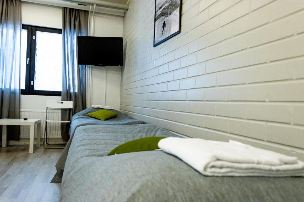 Ένα ή περισσότερα κρεβάτια σε δωμάτιο στο Outdoor Hostel Laajis