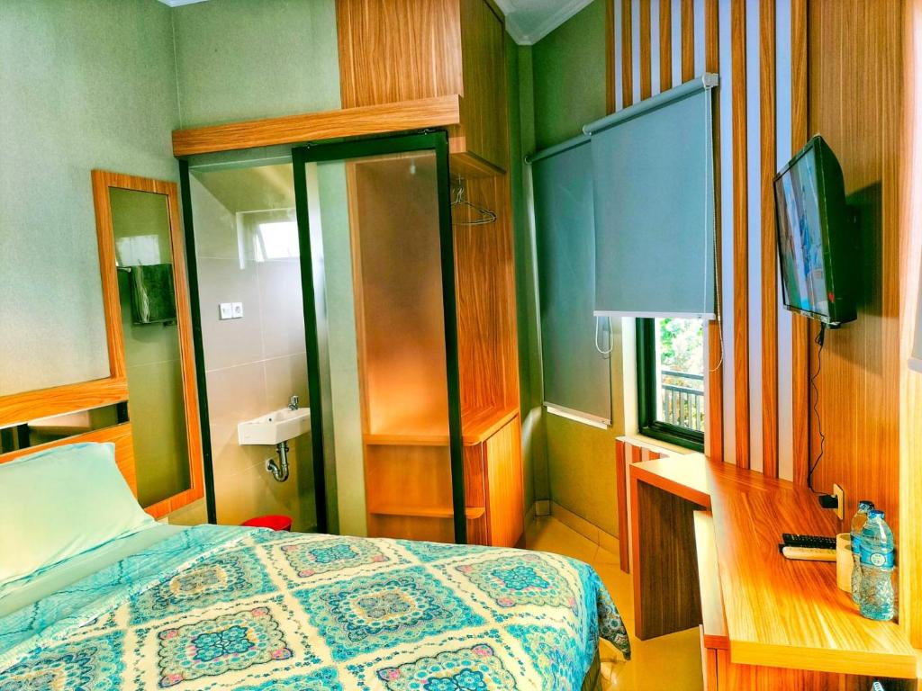 TV a/nebo společenská místnost v ubytování Cozy Residence Tomang