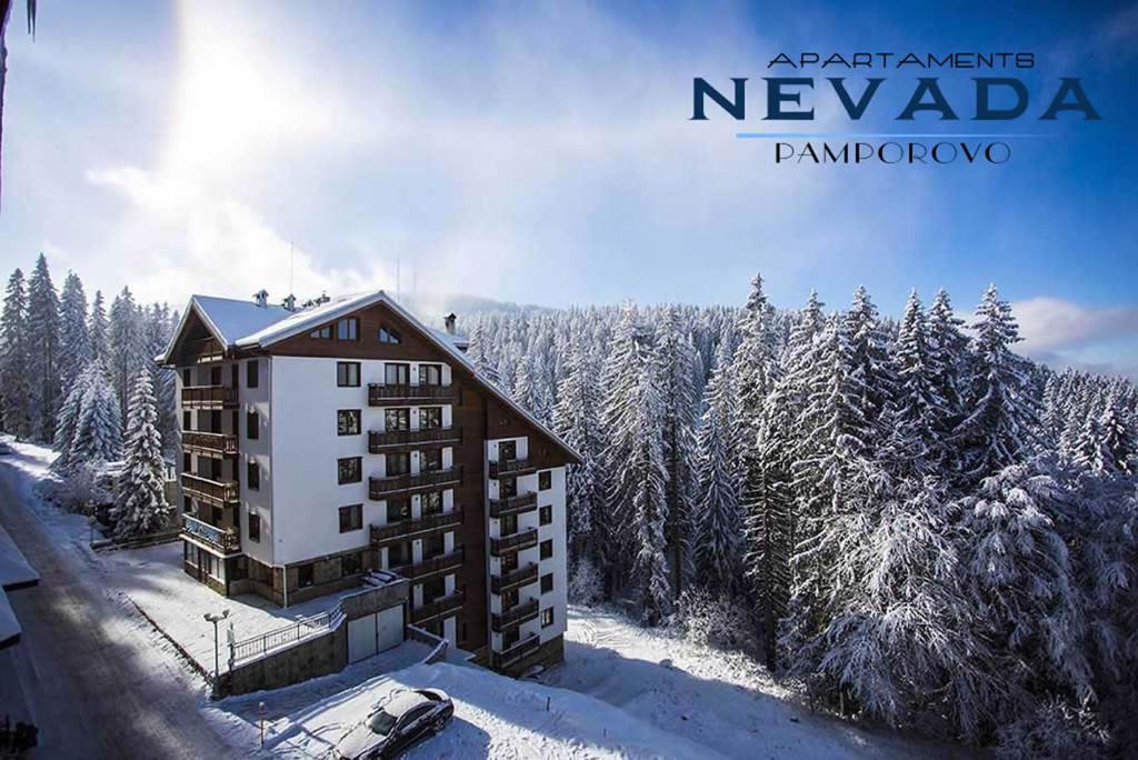 an aerial view of a building in the snow at Nevada Aparthotel in Pamporovo