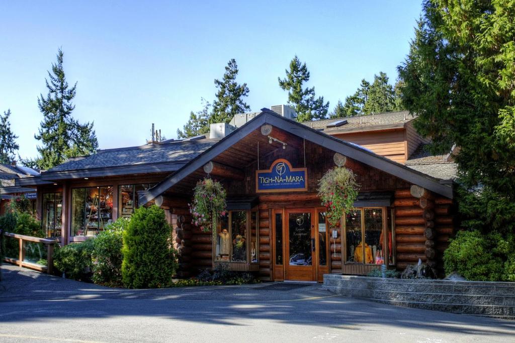 a log cabin building with a store at Tigh-Na-Mara Seaside Spa Resort in Parksville