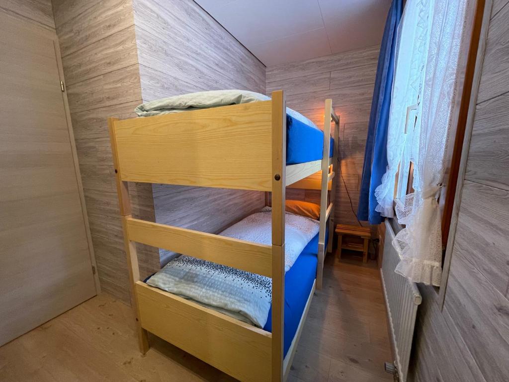 Postel nebo postele na pokoji v ubytování Hälmli