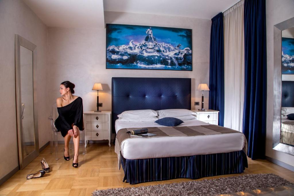 Postel nebo postele na pokoji v ubytování Hotel Ariston