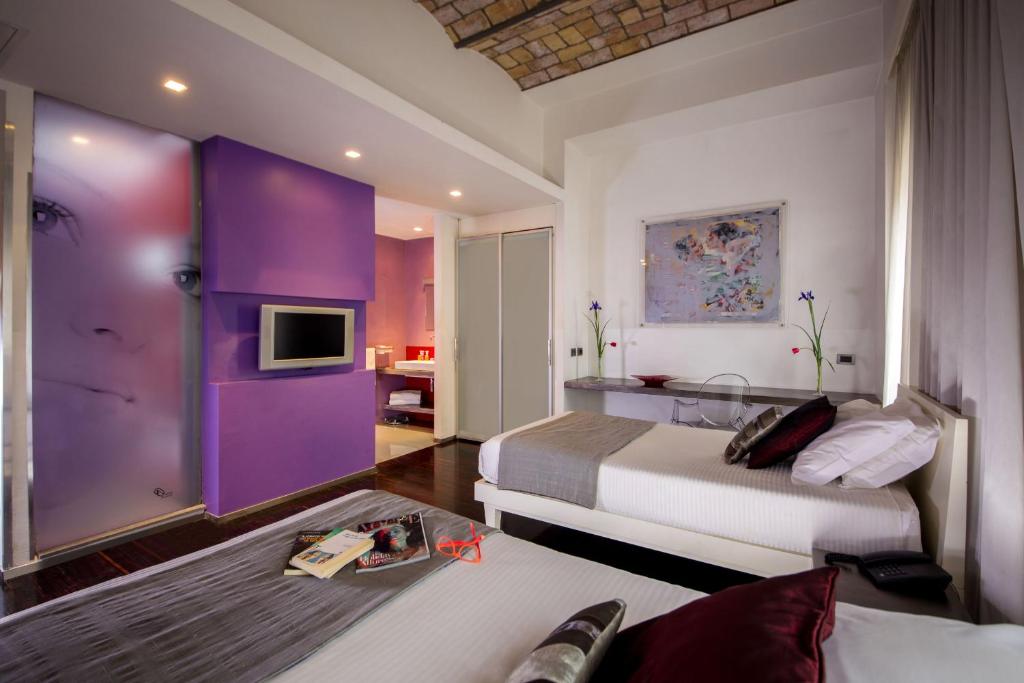 Postel nebo postele na pokoji v ubytování Hotel Ariston
