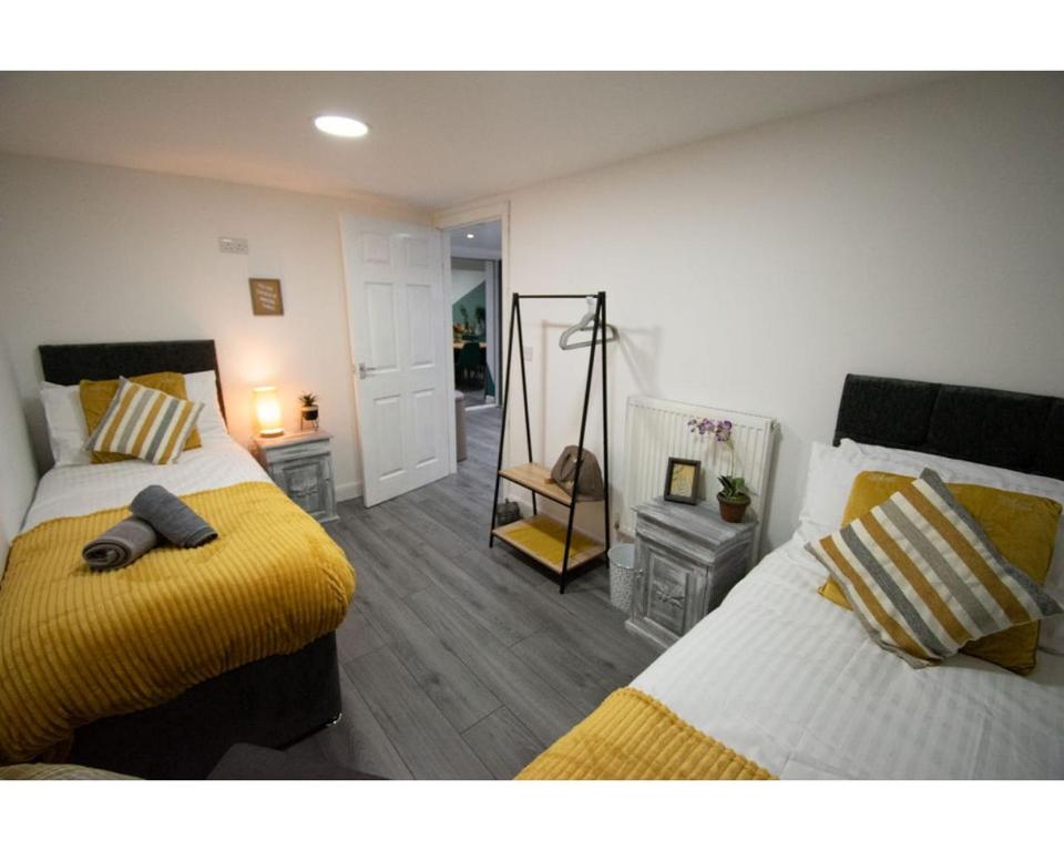 Ένα ή περισσότερα κρεβάτια σε δωμάτιο στο Ideal Lodgings in Baxenden