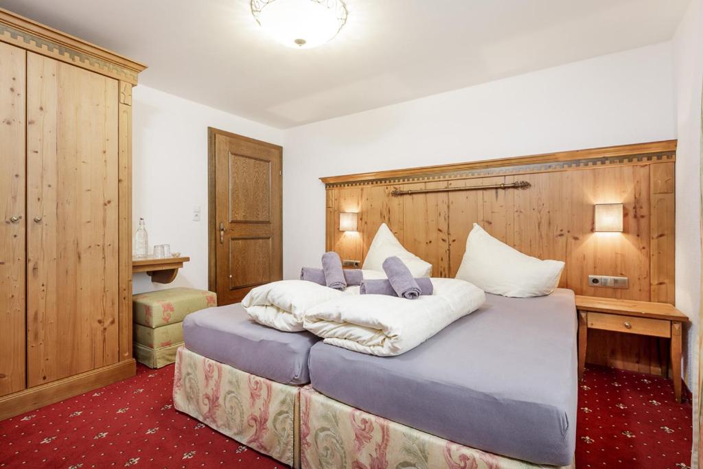 Posteľ alebo postele v izbe v ubytovaní Apart Garni Enzian
