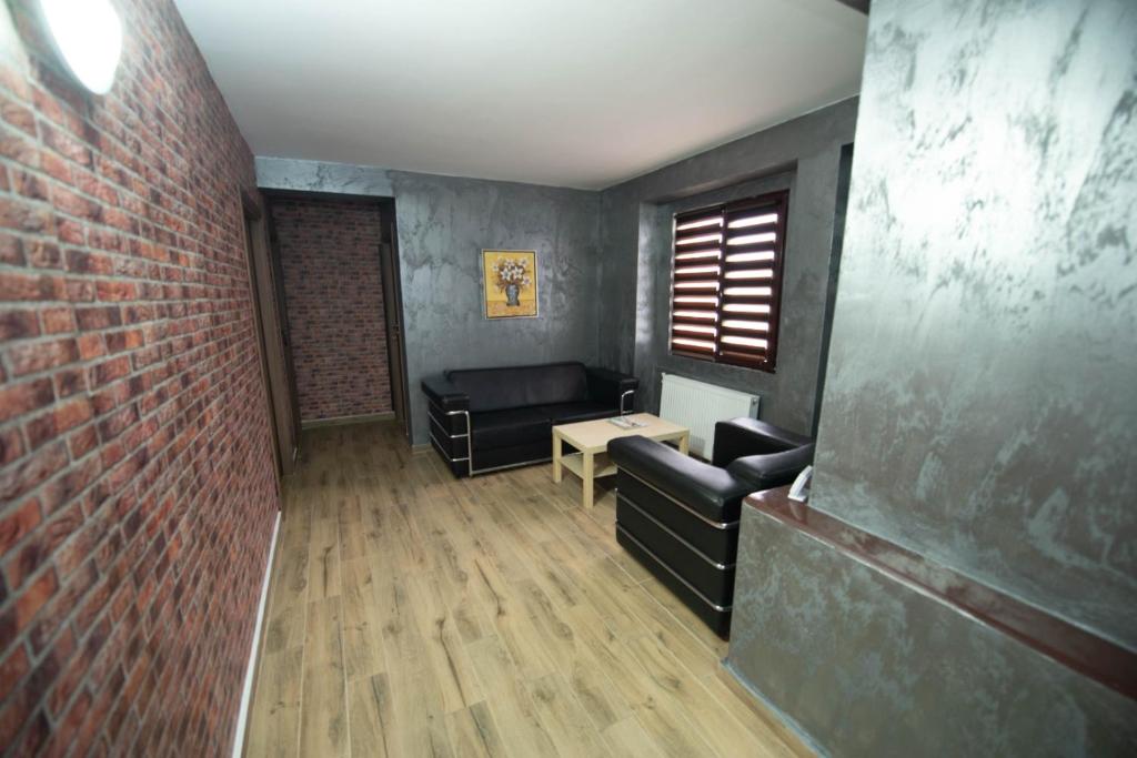 Posezení v ubytování Vila Estera Therme Balotesti