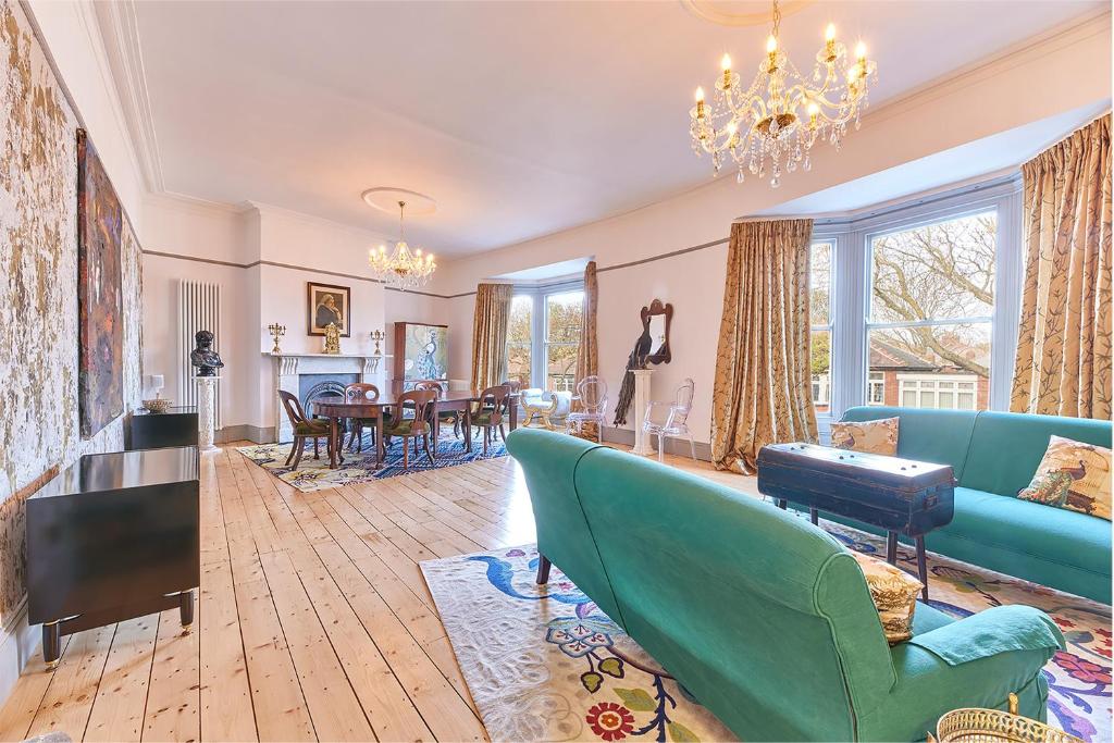 a living room with a couch and a dining room at Host & Stay - Peacock House in Tynemouth