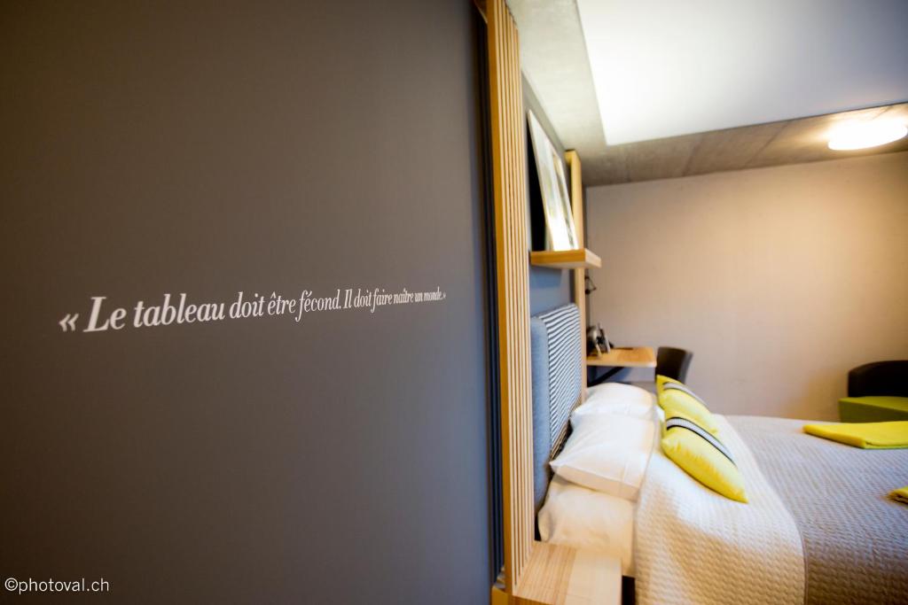 Postel nebo postele na pokoji v ubytování Martigny Boutique-Hôtel