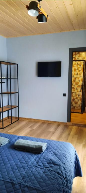 Postel nebo postele na pokoji v ubytování Буковеньки гостинний дім та котеджі