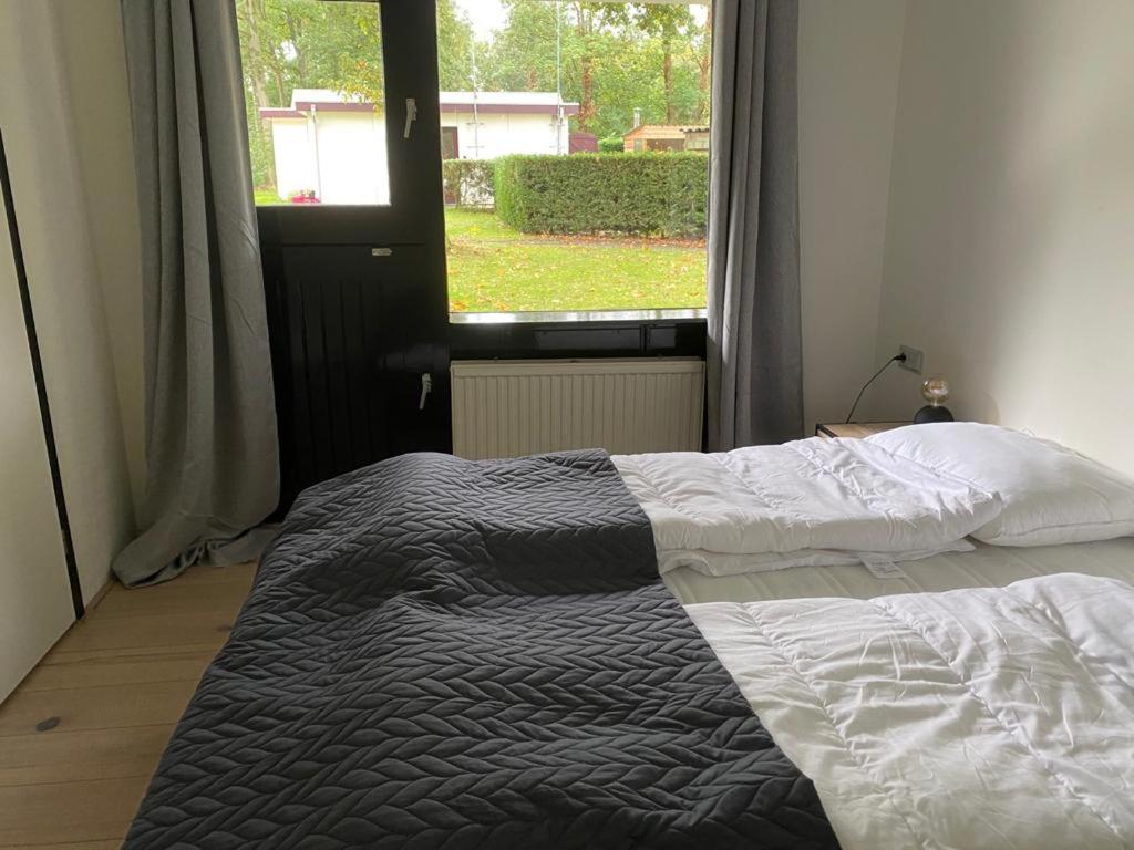 Postel nebo postele na pokoji v ubytování Camping de Vinkenkamp