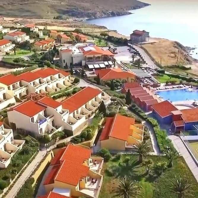 an aerial view of a resort with a pool at Lemnos Village Resort Hotel in Platy