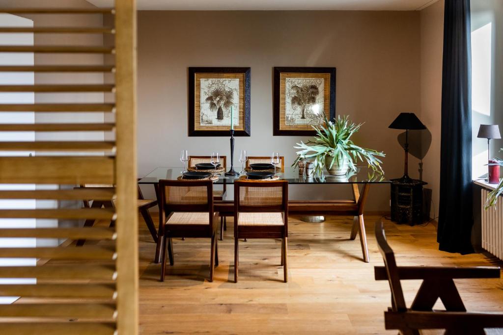 a dining room with a table and chairs at The Pastorini in Zurich