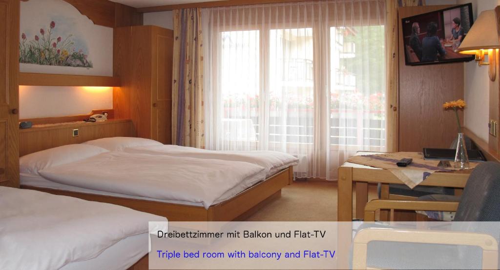 Ein Bett oder Betten in einem Zimmer der Unterkunft Hotel Restaurant Mattmarkblick
